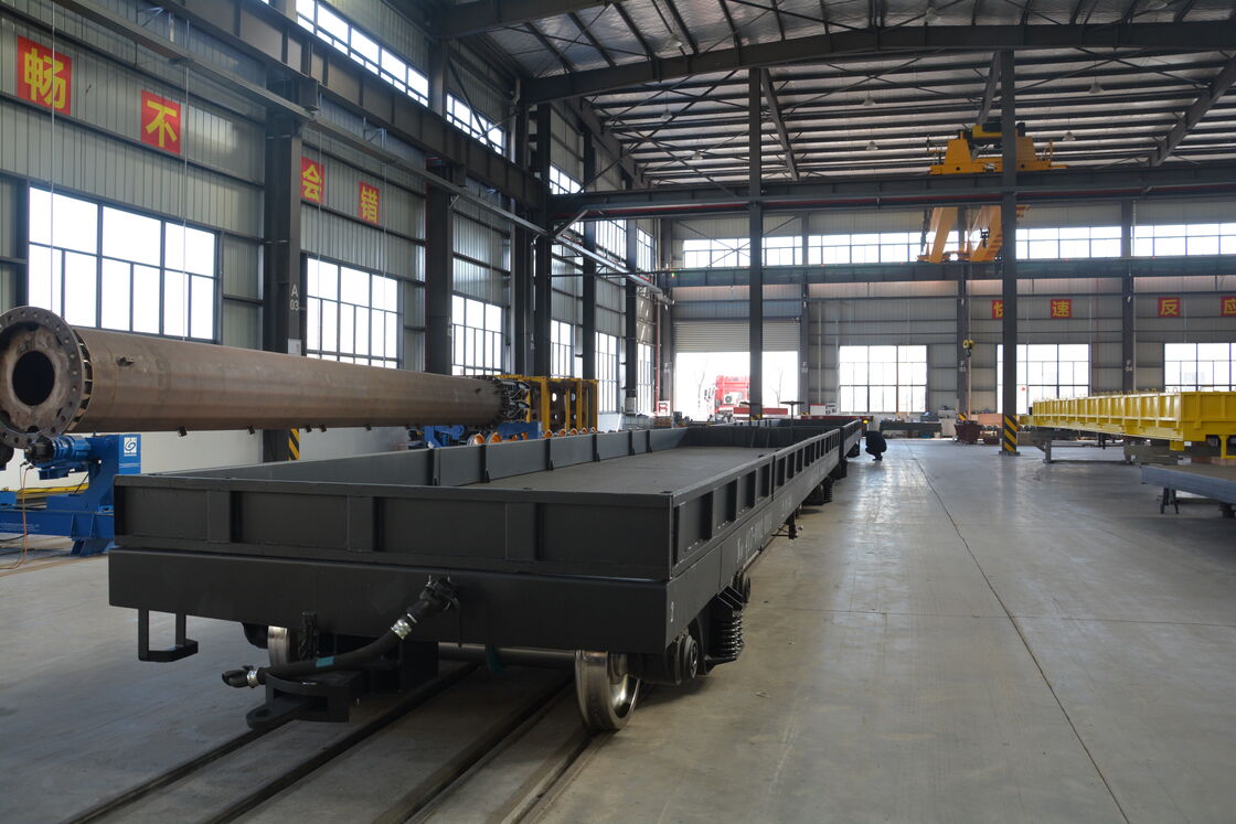 Railway Flat Wagon with 60 Tons Load Capacity, 100 Km/h Max Speed, and Coil Spring Suspension for Heavy Cargo Transport